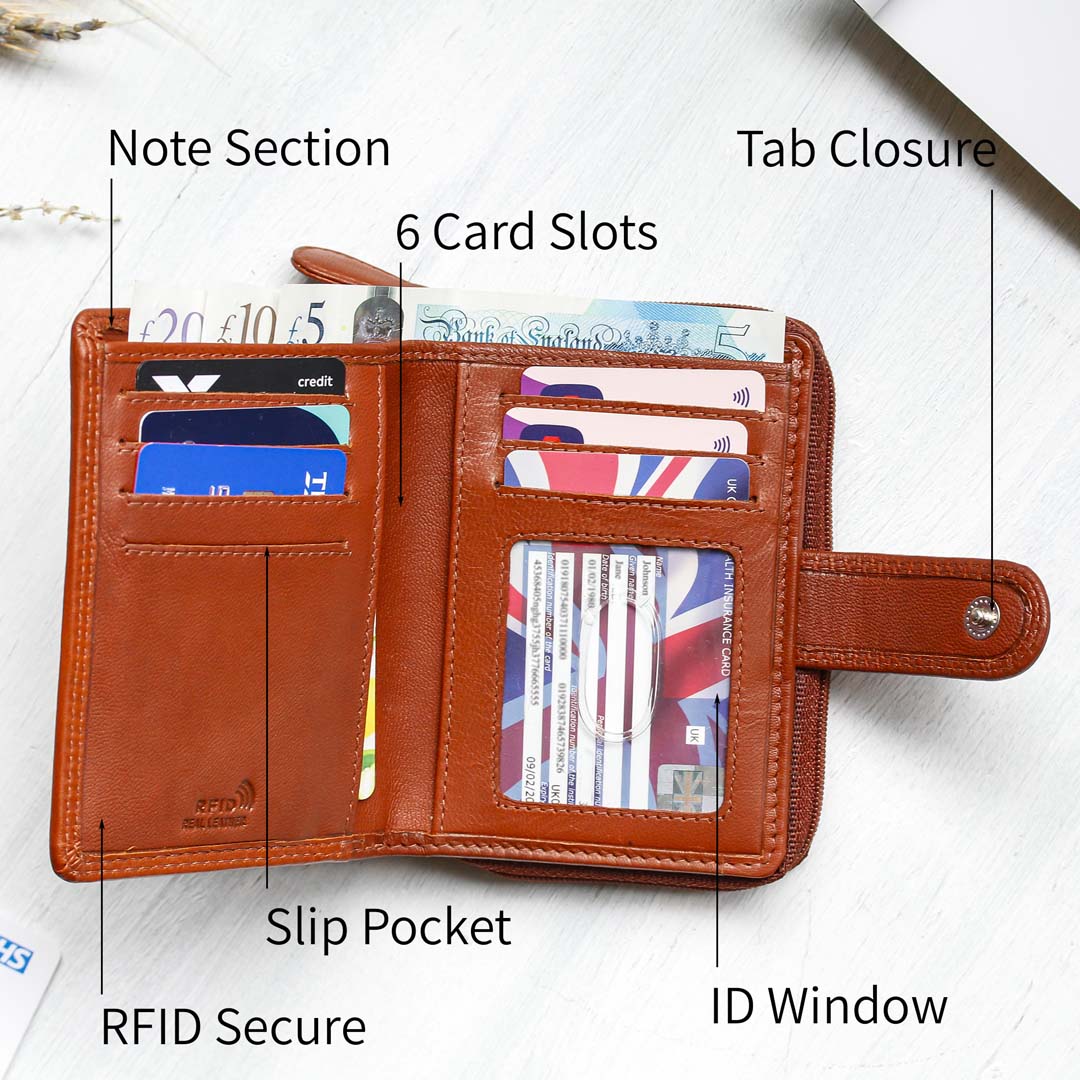 Leather purse with a note section, 6 card slots, tab closure, ID window and slip pockets. The wallet is RFID secure