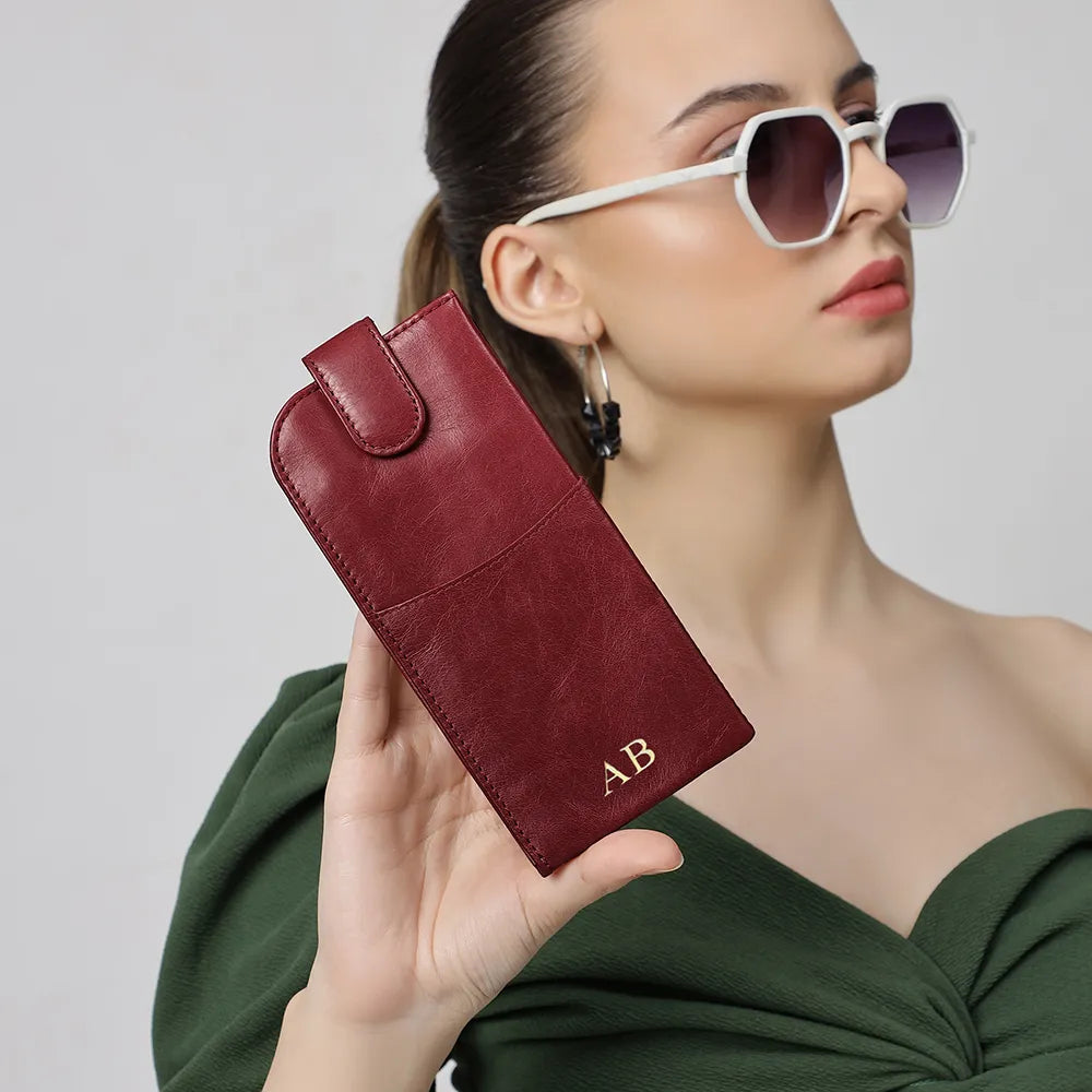 Person holding Bordeaux Leather glasses case