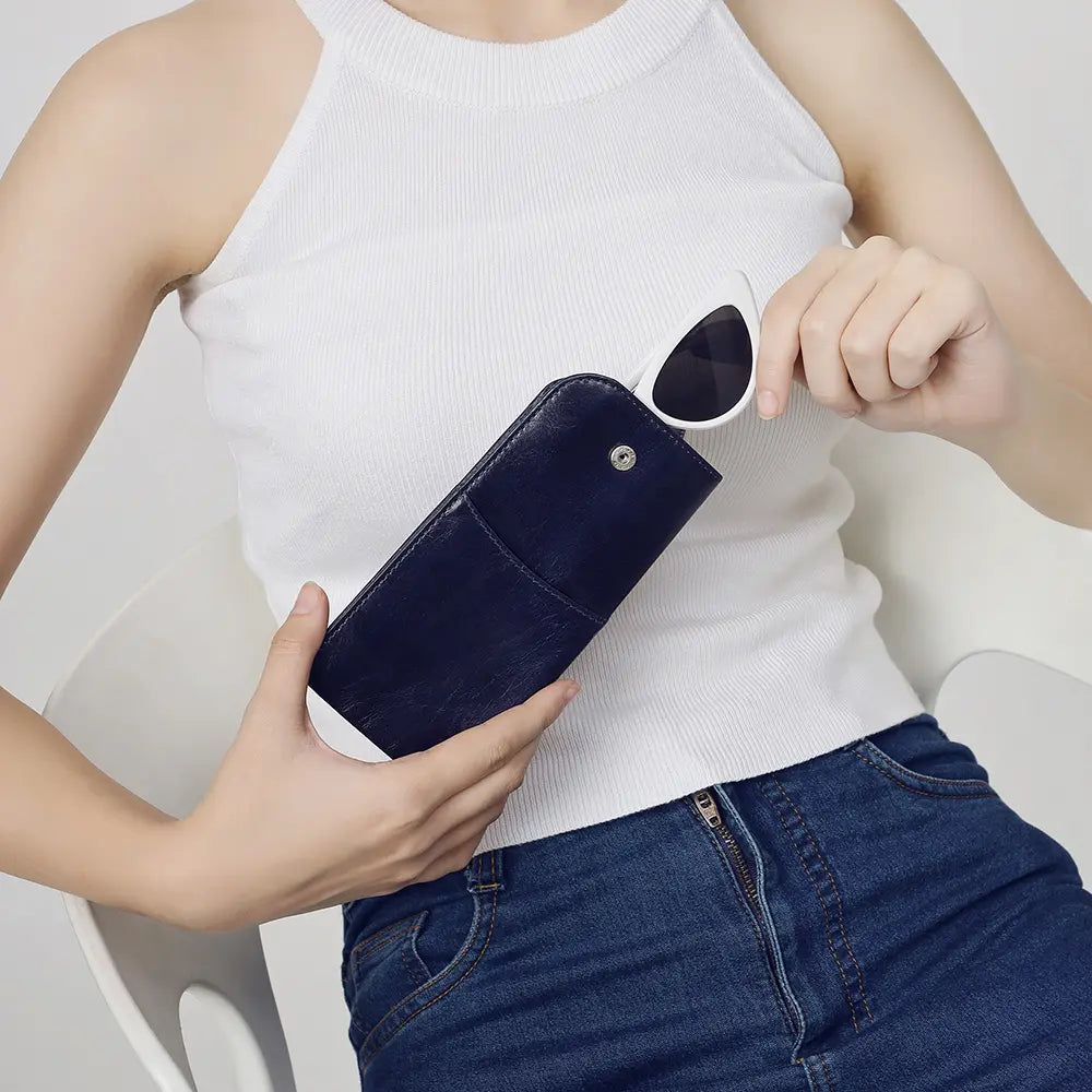 Person holding Navy Leather Glasses Case