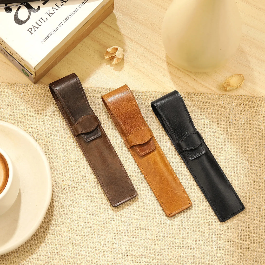 Tan leather pen holder on a white background