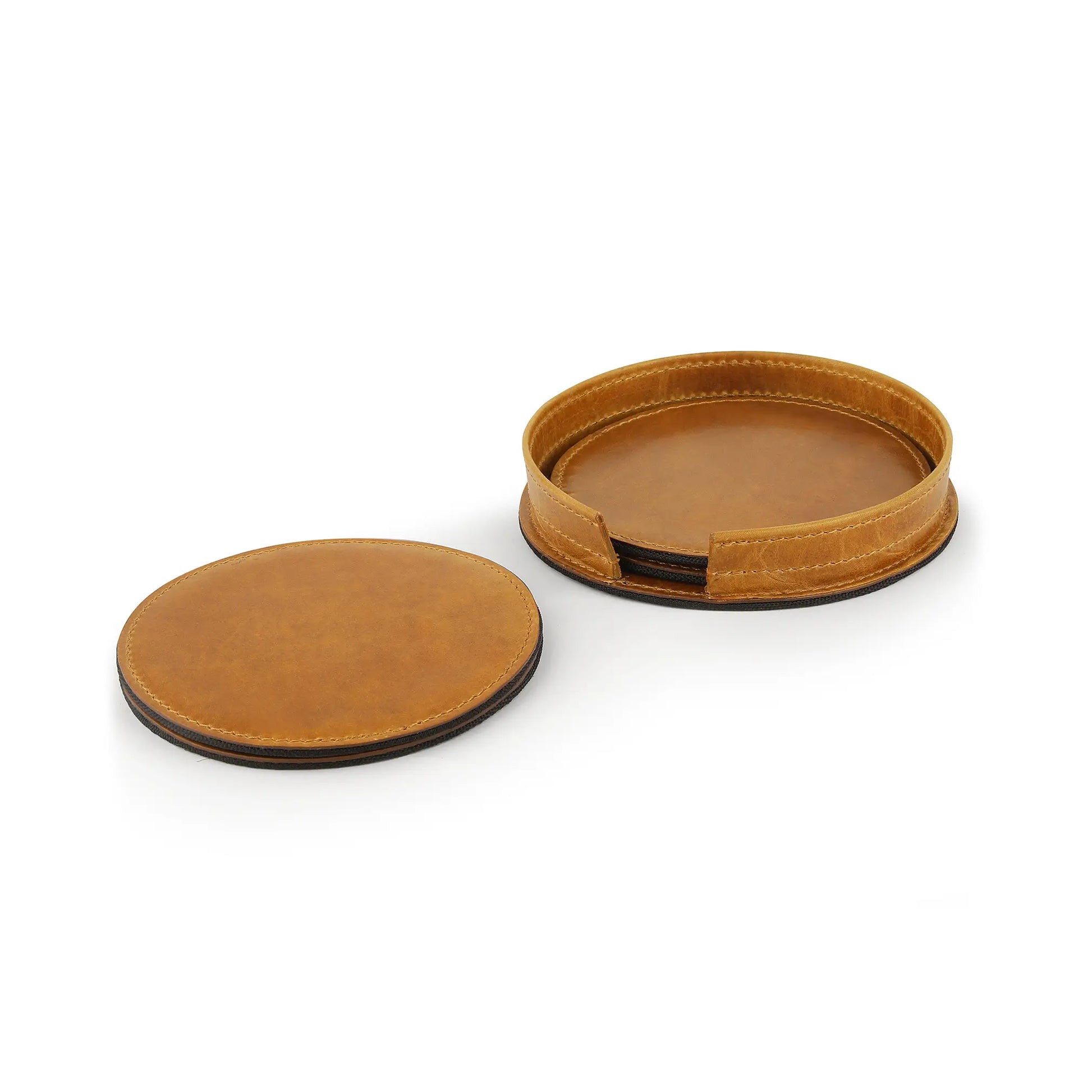 Two tan leather coasters on a white background