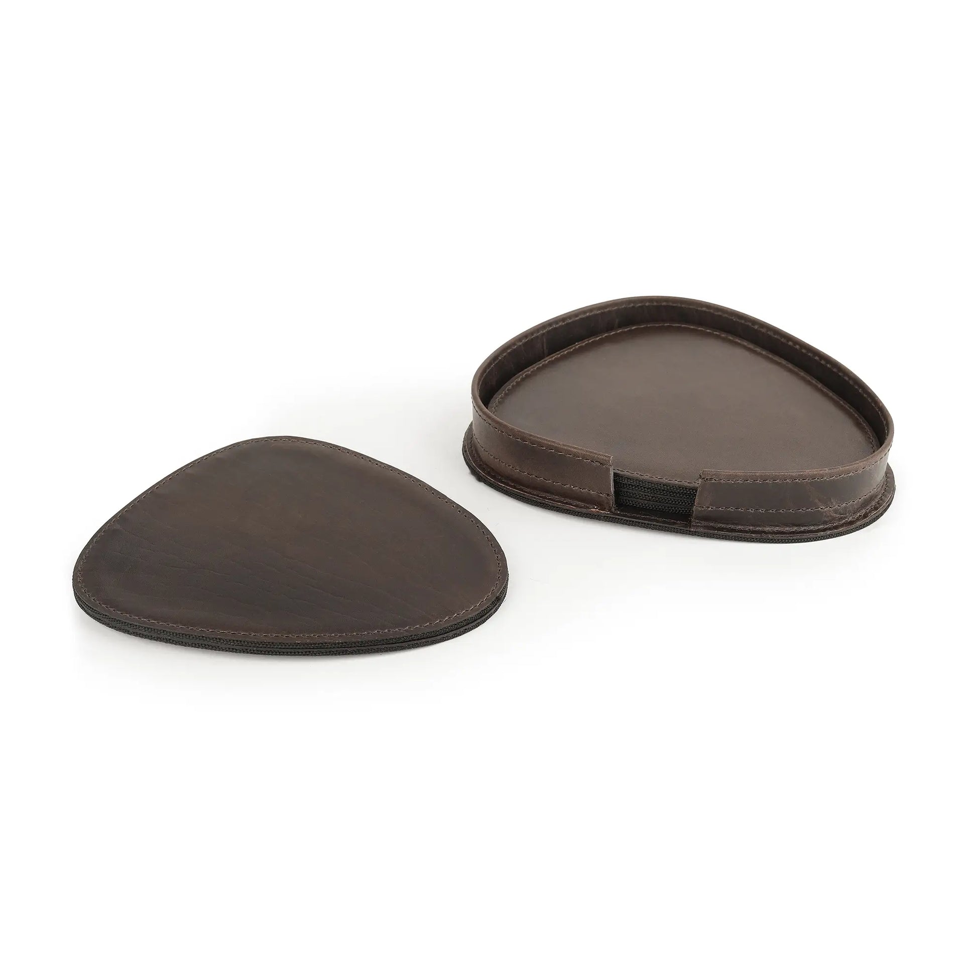 Two brown leather coasters on a white background