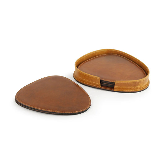Two tan leather coasters on a white background