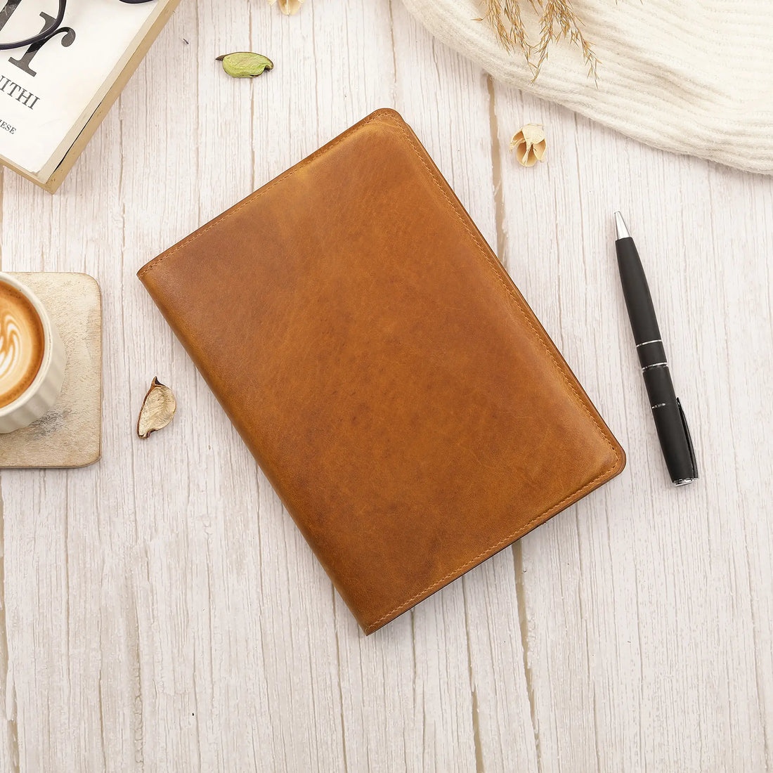 Tan  leather diary cover on a white background