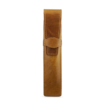 Tan leather pen holder on a white background