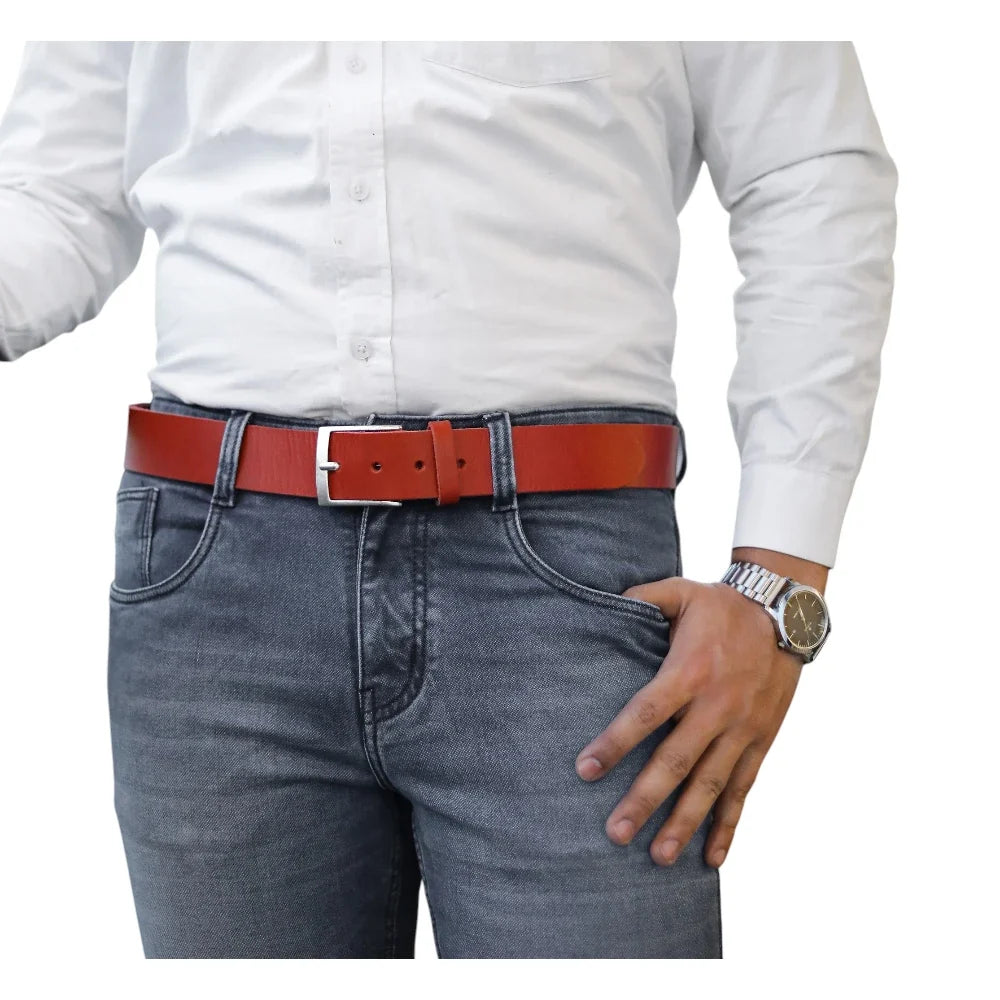 Person wearing a red belt and gray jeans on a white background