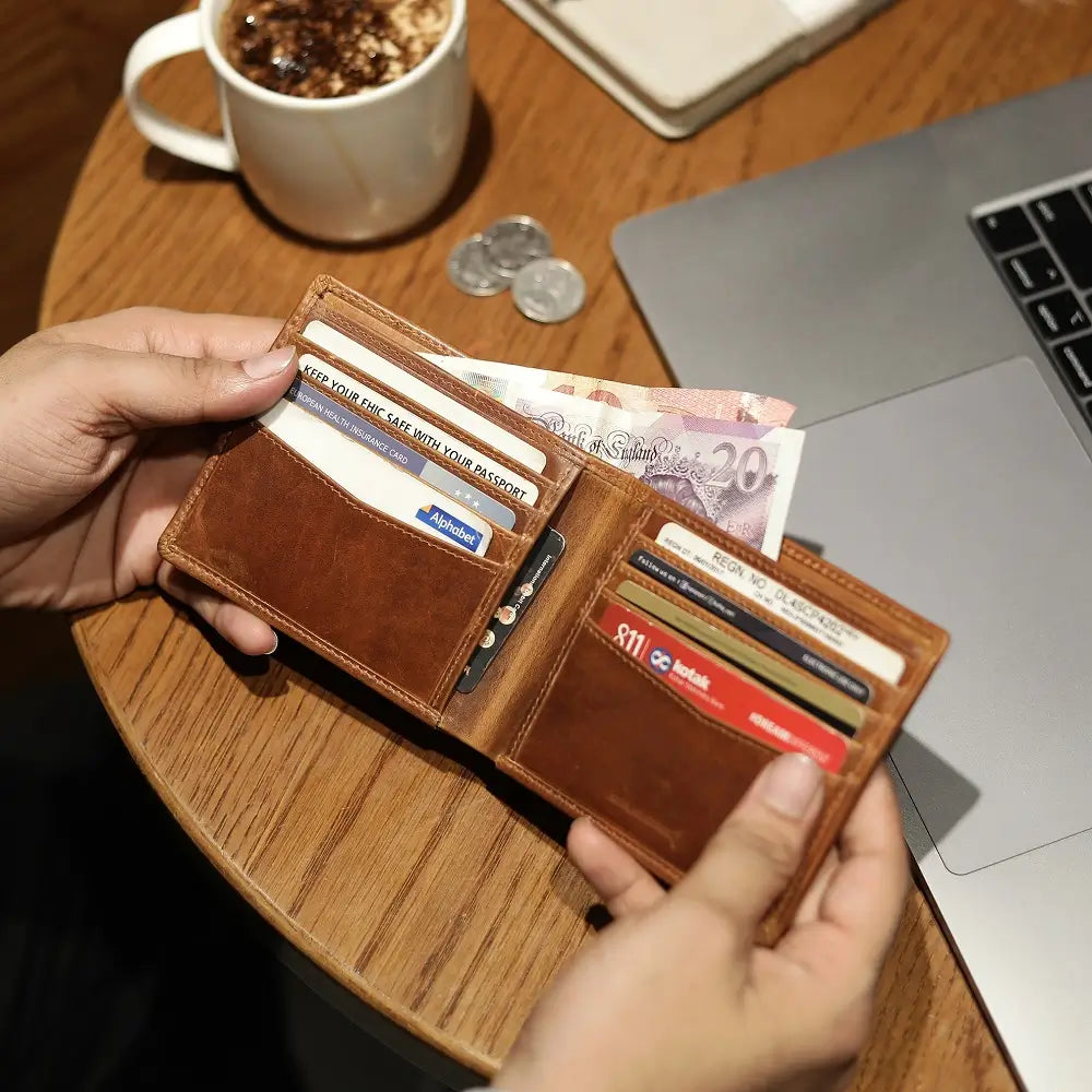 Tan leather wallet on a white background