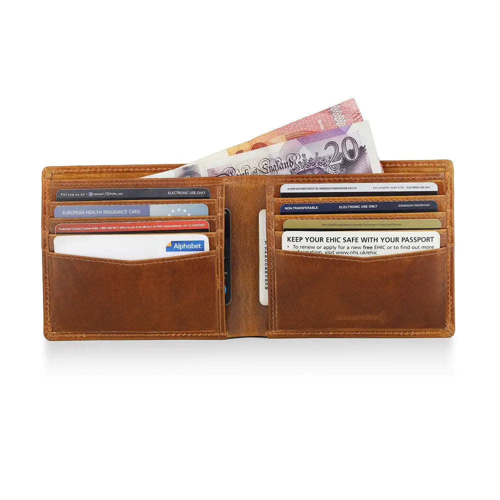 Tan leather wallet with money and cards on a white background