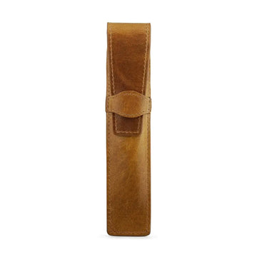 Tan leather pen holder on a white background