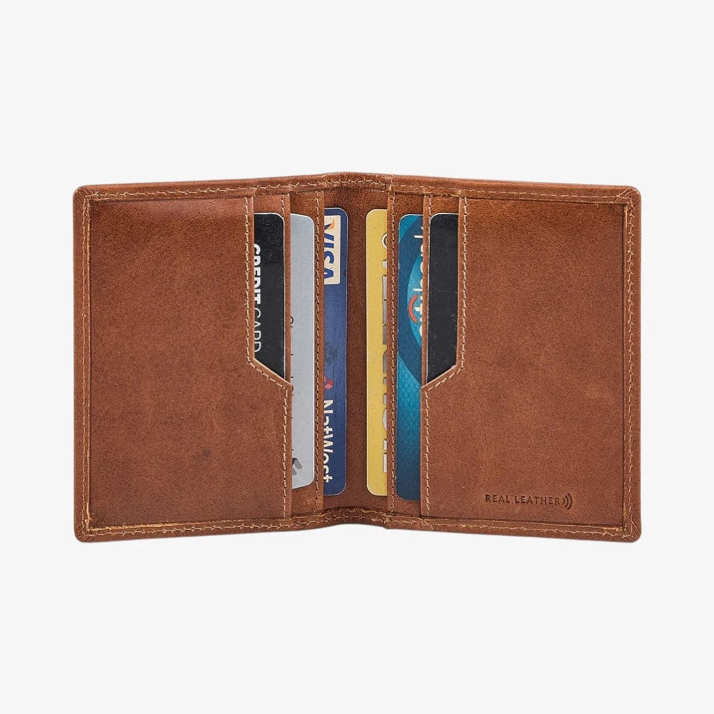 Tan leather credit card holder with cards on a white background